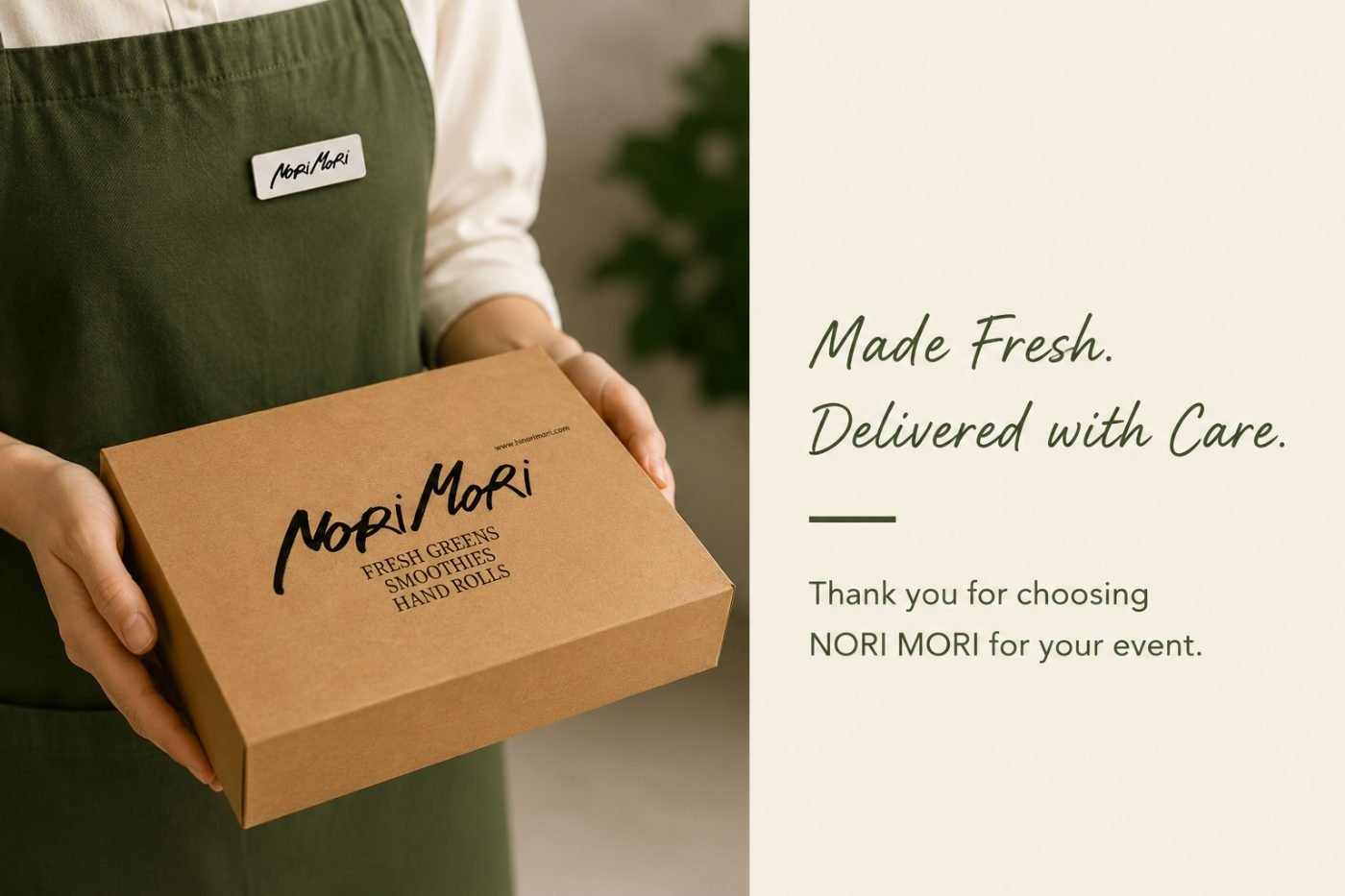 A Nori Mori team member holding a catering box