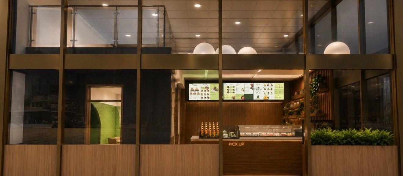The Nori Mori storefront at One California Street, with illuminated menu screens and a pick-up counter